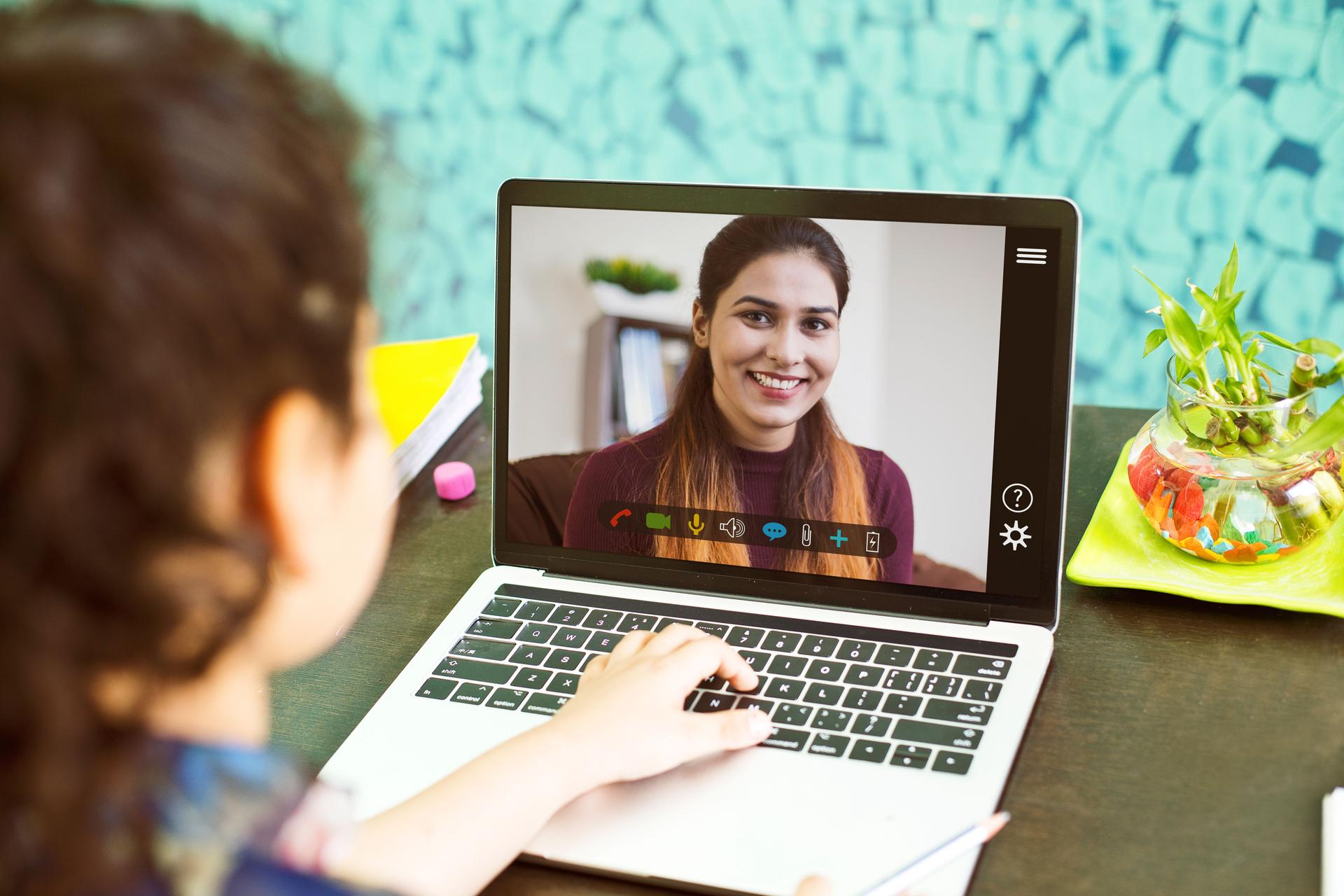 Homeschooling distance learning at home with teacher teaching remotely